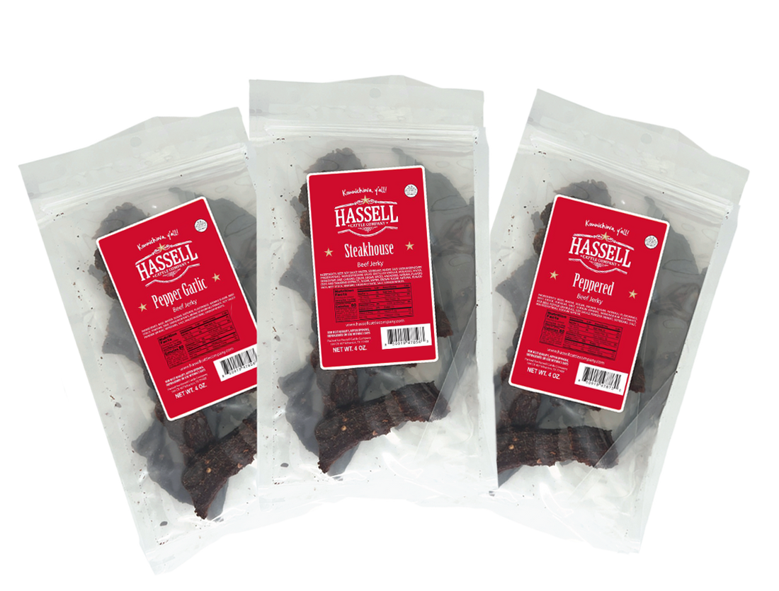 3 pack premium beef jerky from Hassell Cattle Company, three flavors included peppered, pepper garlic, and steakhouse, offering a tender, flavorful snack perfect for on-the-go.
