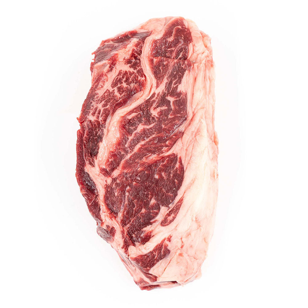 Cut of Hassell Cattle Company Chuck Eye Steak, showcasing a marbled, tender, and flavorful piece of beef perfect for grilling or pan-searing.