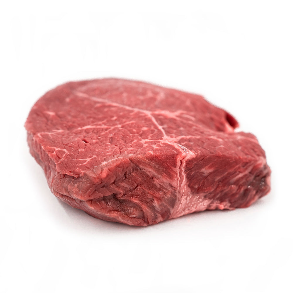 Gold Sirloin on butcher paper at a Texas backyard table for the Two Gold Sirloin Finish