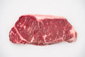 Real Hassell Cattle New York Strip raw product photo.
