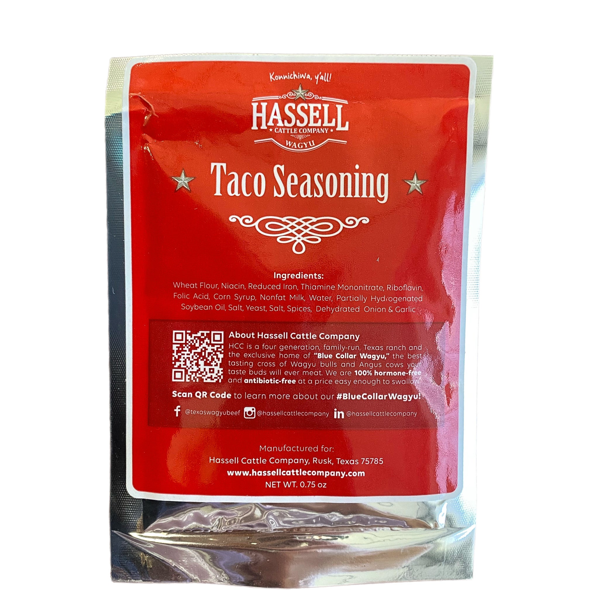 A pack of Hassell Cattle Company Taco Seasoning, featuring a sleek label with bold branding, filled with a rich, earthy-colored spice blend, set against a clean, neutral background