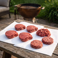 Gold Sirloins, ground Wagyu, and burger patties on butcher paper for the Backyard Sirloin and Burger Pack