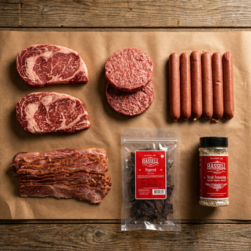 THE COOKOUT BOX — Wagyu ribeyes, patties, beef franks, bacon, branded Hassell jerky and Garlic Butter seasoning on butcher paper
