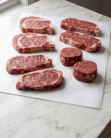 Gold Steakhouse Eight raw Gold Wagyu steaks on butcher paper from Hassell Cattle Company