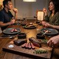 Steakhouse at home lifestyle image using New York strips in a premium dinner setting.