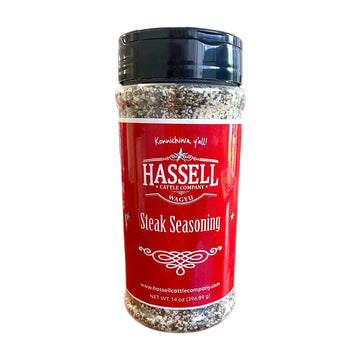 A bottle of Hassell Cattle Company Steak Seasoning, crafted to enhance the flavor of your favorite cuts of beef.