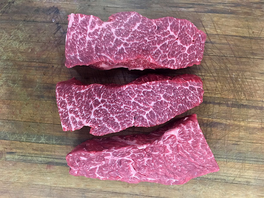 Wagyu Denver steaks on the butcher block