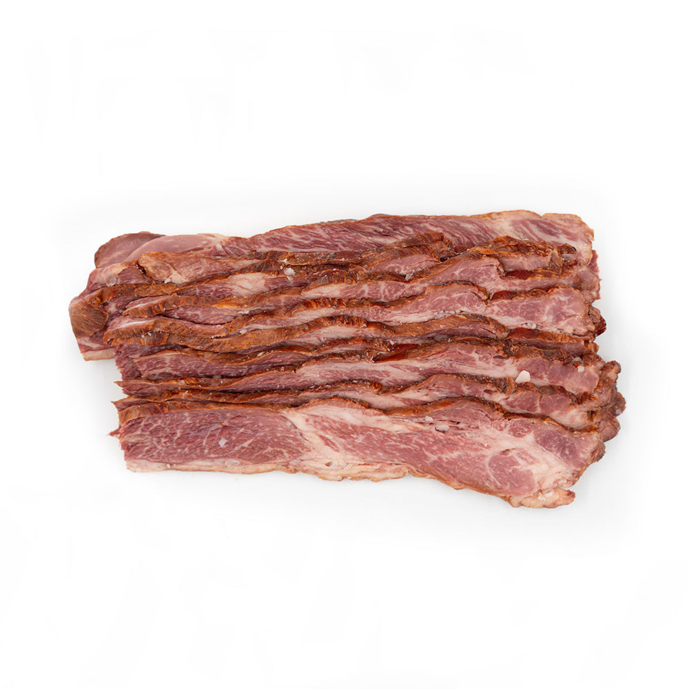 Close-up of Hassell Cattle Company Beef Bacon, showcasing thick, juicy slices with rich marbling and a savory golden-brown crisp.
