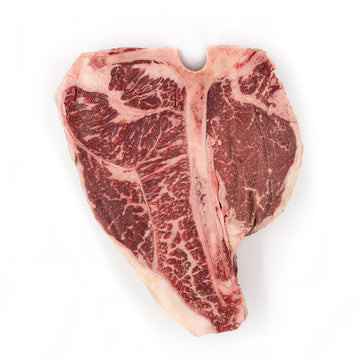 Porterhouse steak from Hassell Cattle Company, a perfectly marbled cut offering both tenderloin and strip steak in one, ideal for grilling or pan-searing.