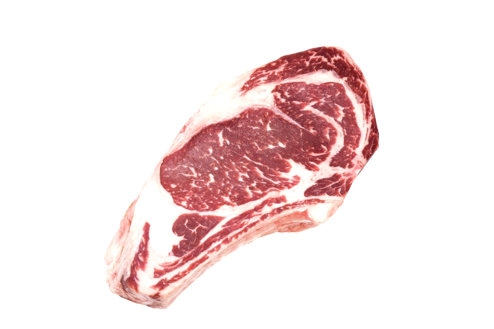 A thick, bone-in Hassell Cattle Company Cowboy Ribeye steak, showcasing its rich marbling and tender texture.