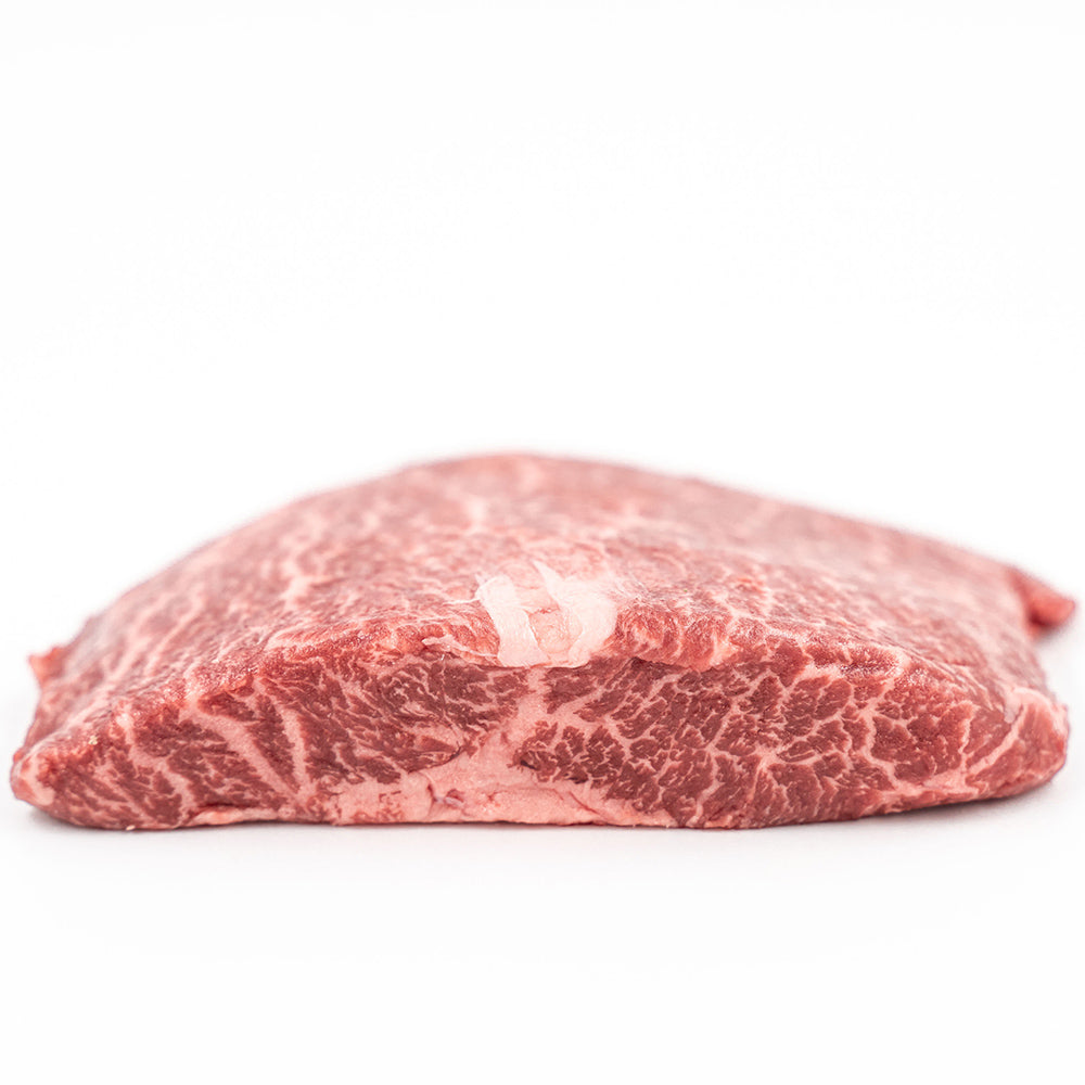 Tender and juicy flat iron steak, known for its rich marbling and perfect for grilling or pan-searing.